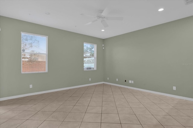 unfurnished room featuring ceiling fan and light tile patterned floors