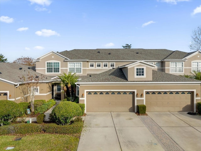 multi unit property featuring a garage