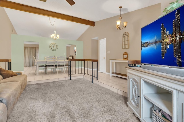 living room featuring lofted ceiling with beams, light tile patterned floors, and ceiling fan with notable chandelier