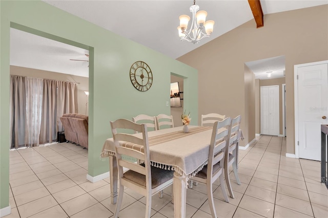 tiled dining room featuring ceiling fan with notable chandelier and lofted ceiling with beams