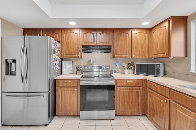 kitchen featuring light tile patterned floors and appliances with stainless steel finishes