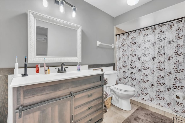 bathroom featuring a shower with curtain, tile patterned flooring, vanity, and toilet