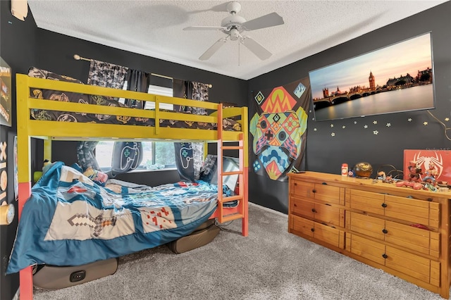 bedroom with carpet, ceiling fan, and a textured ceiling