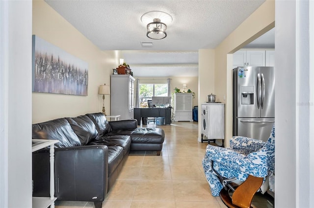 tiled living room with a textured ceiling