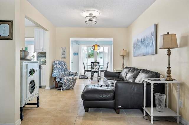 tiled living room with a textured ceiling