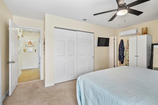 bedroom featuring ceiling fan, light carpet, and a wall mounted air conditioner