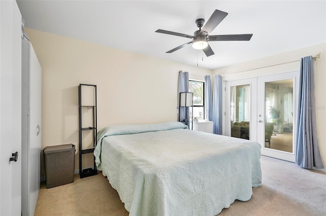 carpeted bedroom featuring ceiling fan, access to exterior, and french doors