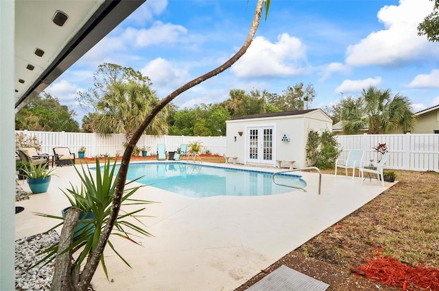 view of pool featuring a patio area and an outdoor structure