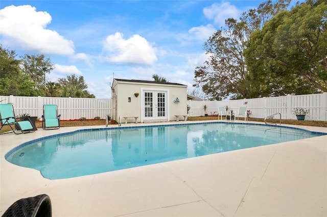 view of pool featuring an outdoor structure and a patio area