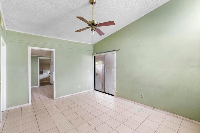 tiled spare room with ceiling fan, lofted ceiling, and a textured ceiling