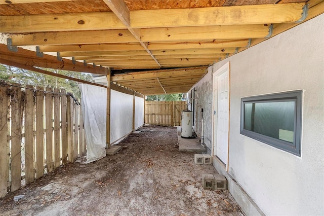 view of side of home with gas water heater