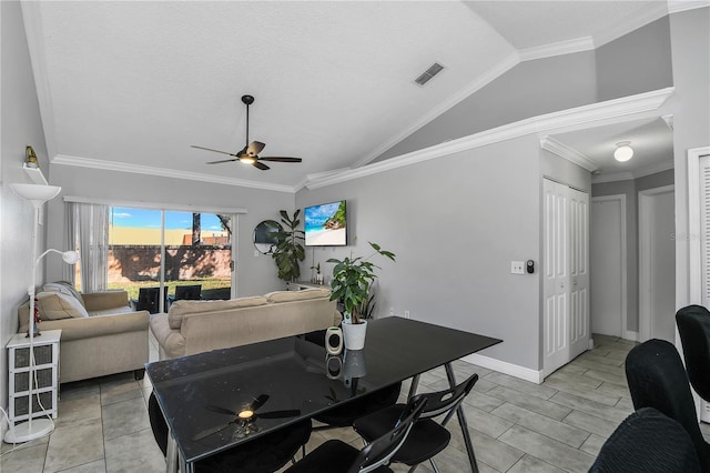 dining area with baseboards, ornamental molding, a ceiling fan, and vaulted ceiling