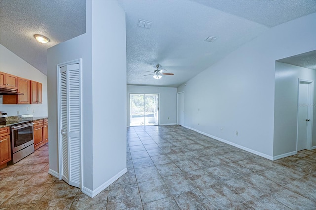 kitchen featuring vaulted ceiling, ceiling fan, stainless steel electric range, and a textured ceiling