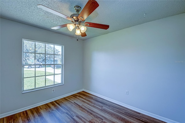 unfurnished room with hardwood / wood-style flooring, a textured ceiling, and ceiling fan