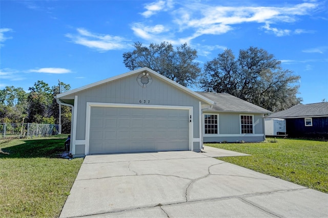 single story home featuring a garage and a front yard