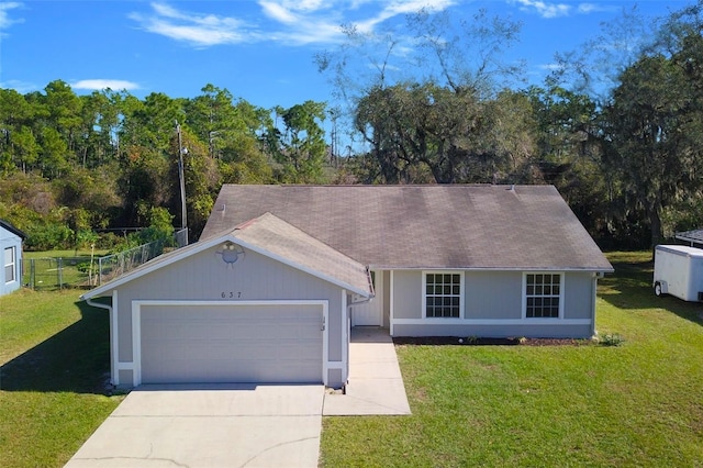 ranch-style home with a garage and a front yard