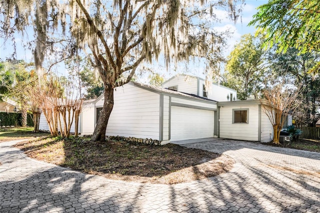 view of property exterior featuring a garage