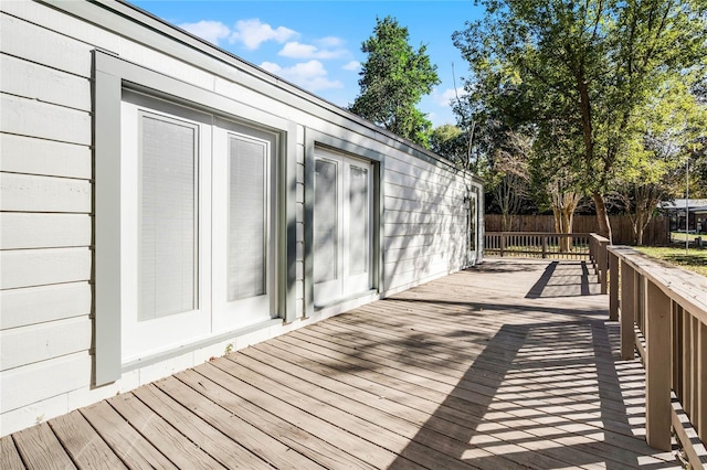 wooden deck featuring fence