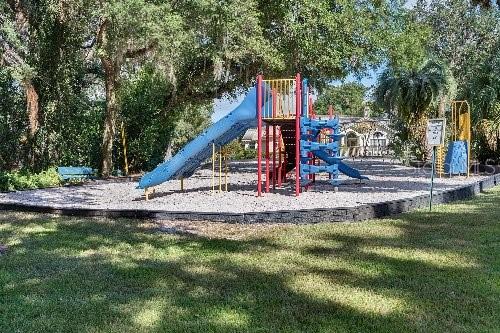 community play area with a lawn