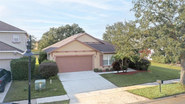 view of front facade with a garage and a front yard