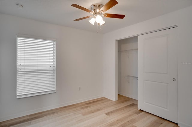 unfurnished bedroom with ceiling fan, light hardwood / wood-style floors, and a closet