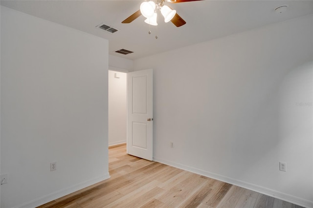 spare room featuring ceiling fan and light hardwood / wood-style floors