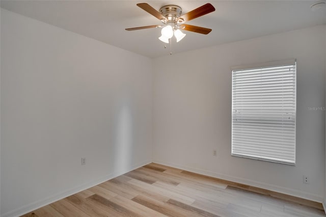 unfurnished room with ceiling fan and light wood-type flooring