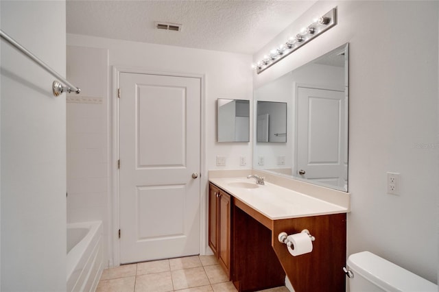 full bathroom featuring bathtub / shower combination, tile patterned flooring, vanity, toilet, and a textured ceiling