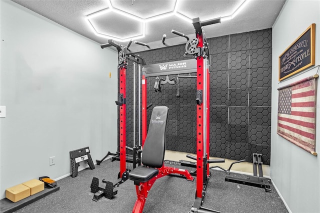 exercise area with a textured ceiling