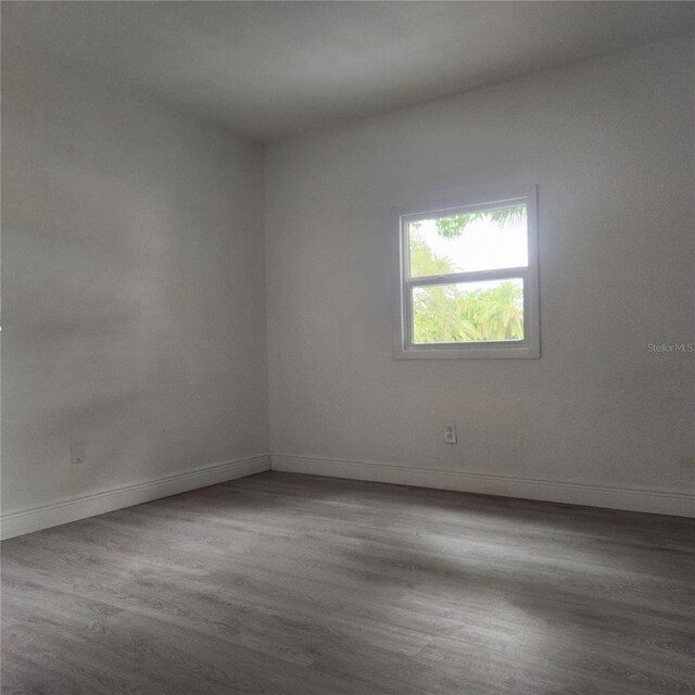 spare room featuring hardwood / wood-style floors