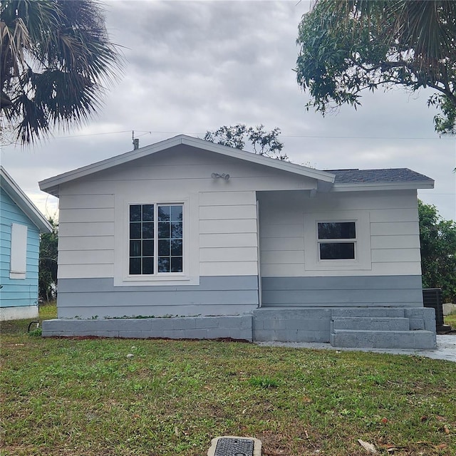 view of property exterior featuring a yard and central AC unit