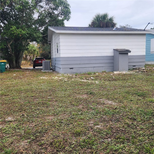 exterior space with a yard and cooling unit