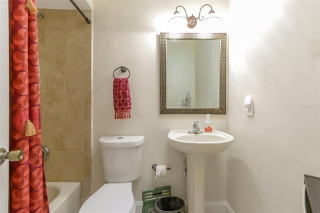 full bathroom featuring sink, shower / bath combo, and toilet