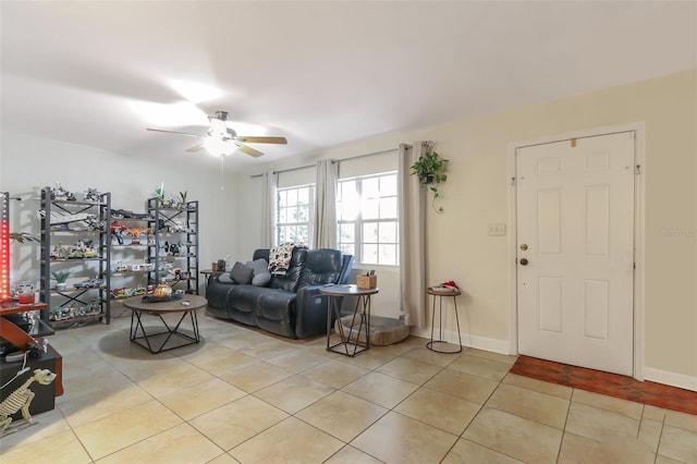 tiled living room with ceiling fan