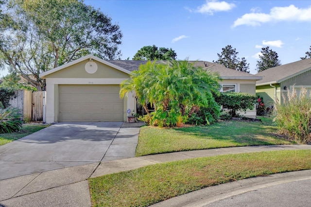 view of front of house featuring a front yard and a garage