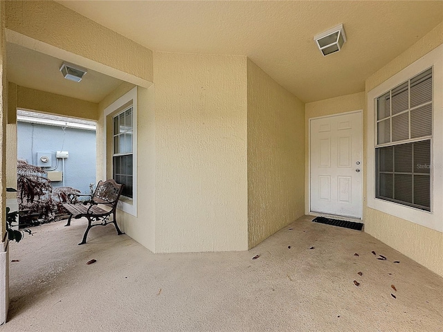 entrance to property with a patio area