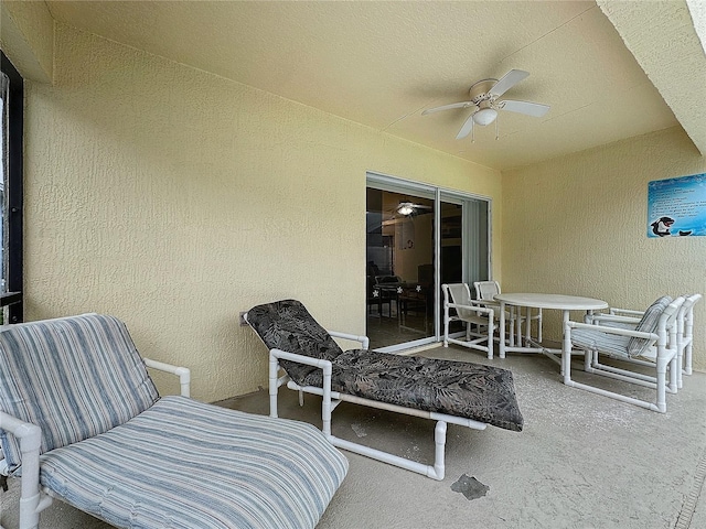 view of patio / terrace featuring ceiling fan