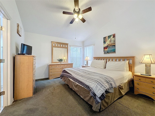 carpeted bedroom with a textured ceiling, ceiling fan, and vaulted ceiling