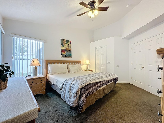 carpeted bedroom with ceiling fan and lofted ceiling