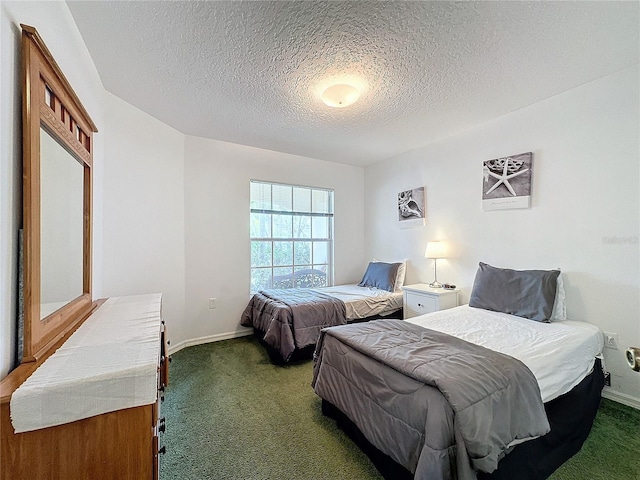 bedroom with carpet and a textured ceiling