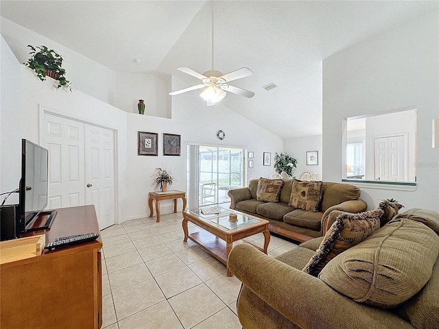 living room with ceiling fan, light tile patterned flooring, and high vaulted ceiling