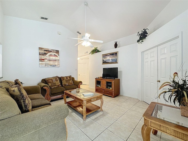 living room featuring ceiling fan, light tile patterned flooring, and lofted ceiling