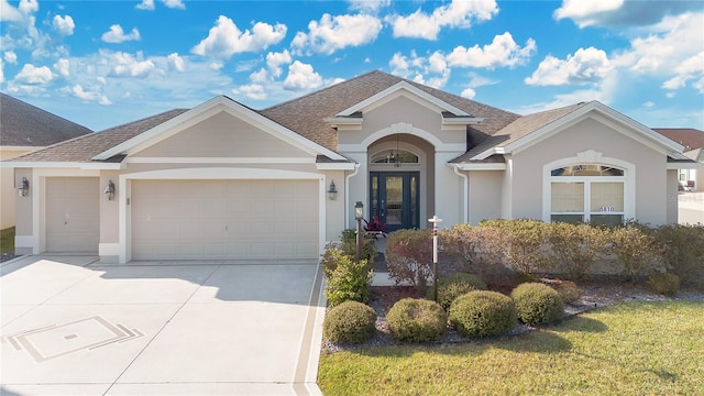 ranch-style home with a front yard and a garage