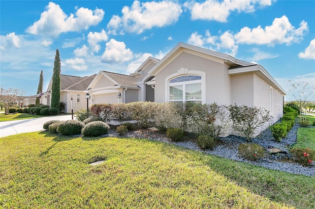 ranch-style home with a garage and a front yard