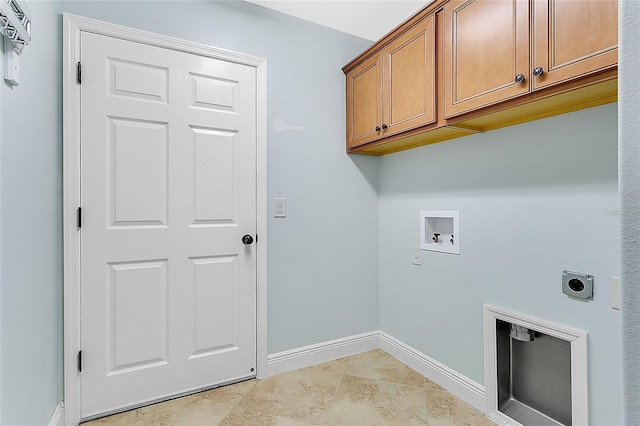 washroom with cabinets, washer hookup, and hookup for an electric dryer