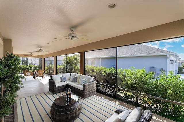 sunroom / solarium with ceiling fan