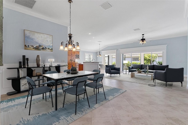 dining space with ornamental molding, a wealth of natural light, ceiling fan, and light tile patterned flooring