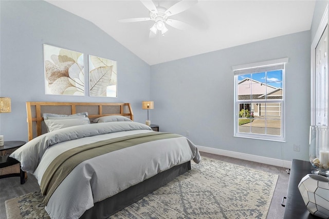 bedroom featuring ceiling fan, vaulted ceiling, and carpet