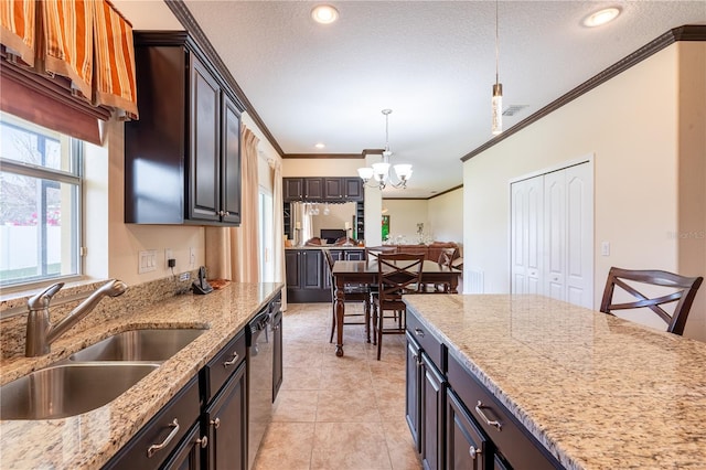 kitchen with crown molding, sink, decorative light fixtures, a notable chandelier, and dark brown cabinets