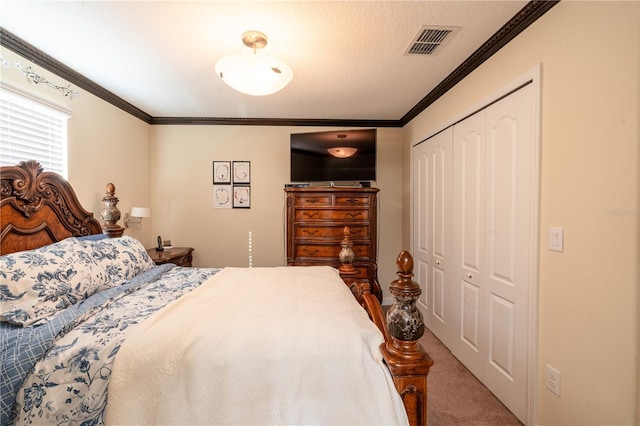 bedroom with carpet flooring, a closet, and ornamental molding